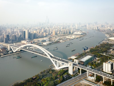 An aerial view water nearby city building during the day
